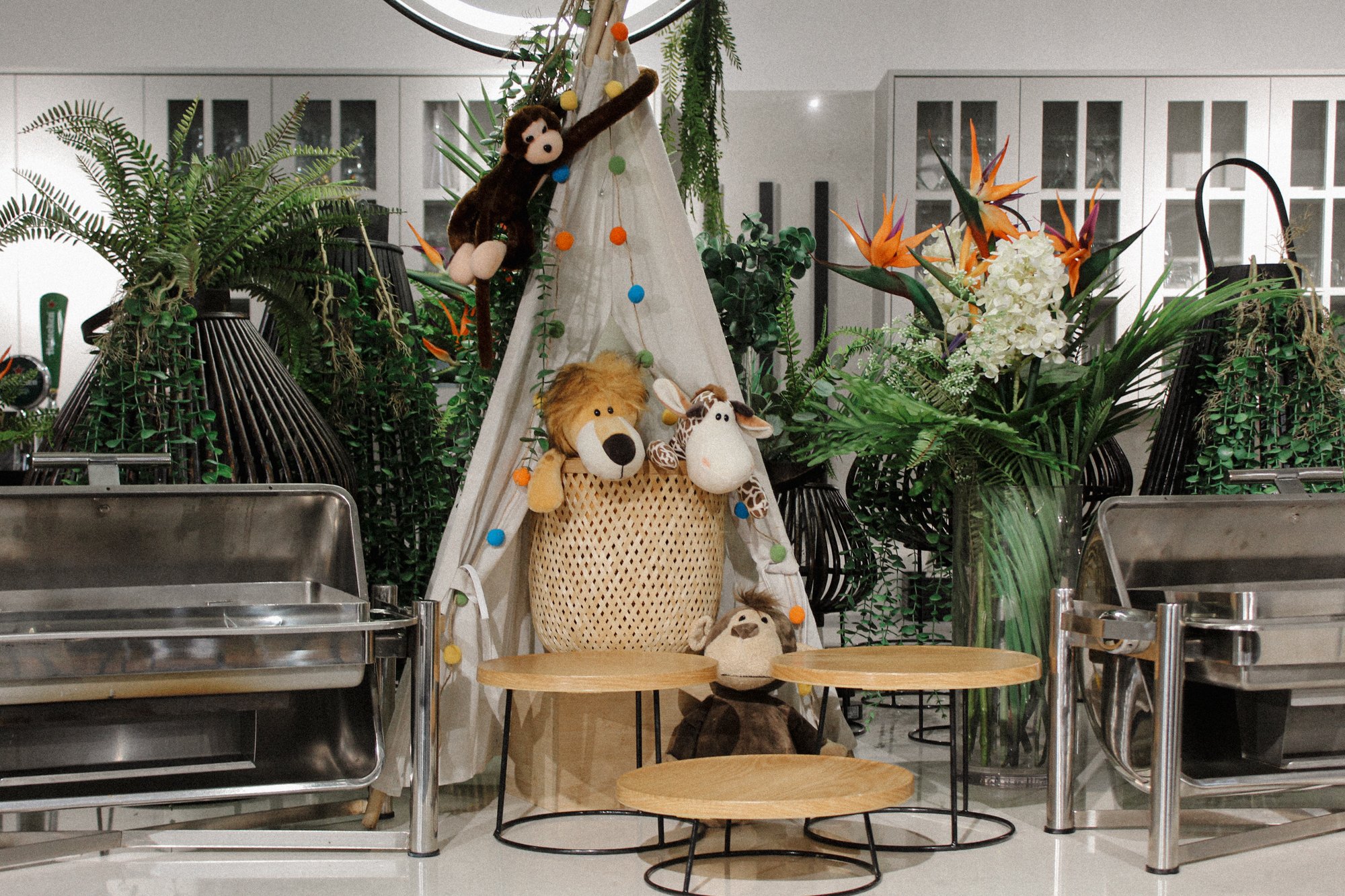 Celebratory buffet setup with Wild Safari themed décor by Four Seasons Catering