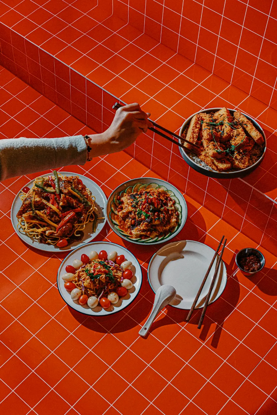Festive Chinese New Year dishes served on a red table