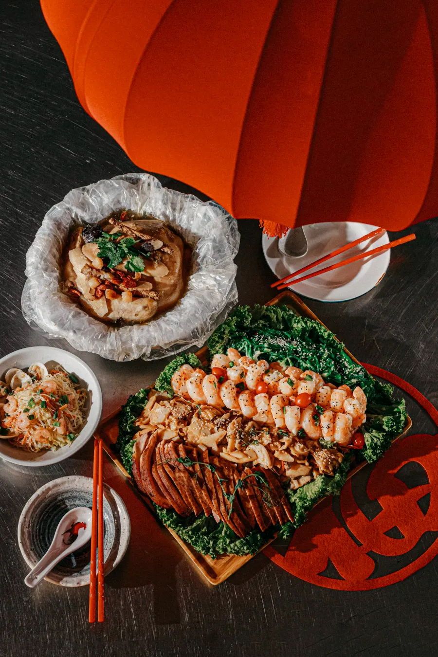 Chinese New Year reunion spread with prawns, braised dishes and a red lantern