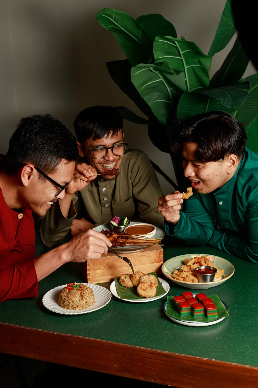 Friends enjoying a Hari Raya meal together