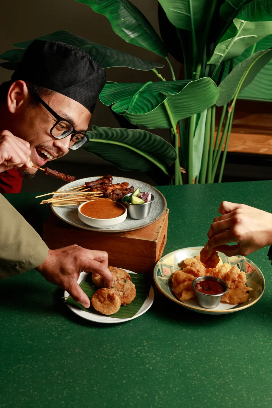 Chef plating a Hari Raya dish
