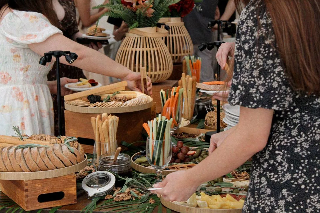 A grazing table with breads, cheeses and crudités